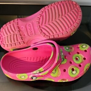CROCS Pink and Green Slippers with Playful Design
